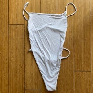 White Revolve bodysuit.